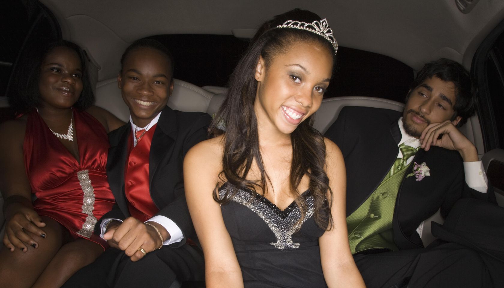 Multi-ethnic teenagers in limousine
