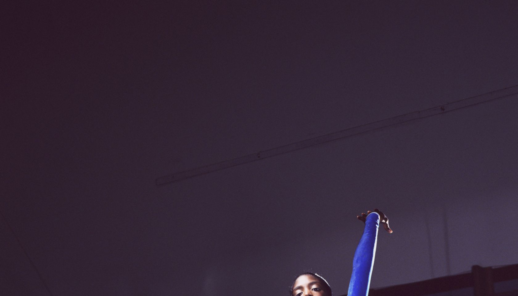 Female gymnast (13-15) doing floor exercise