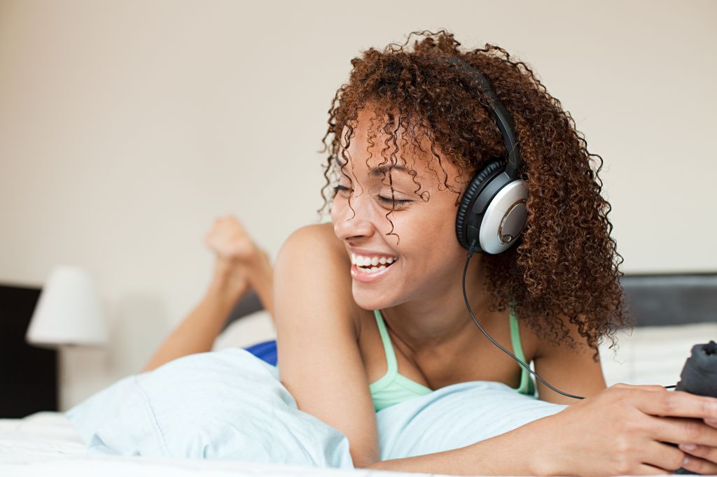 Woman listening to music on mp3 player