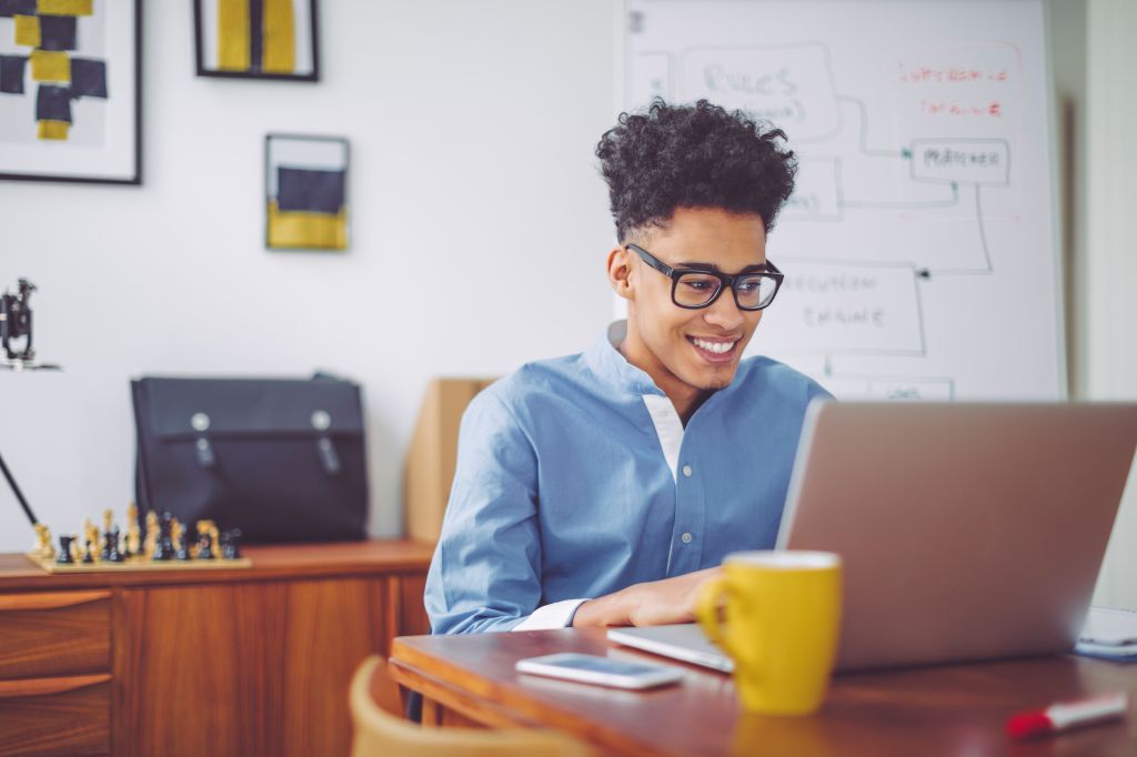 Young man working at home office