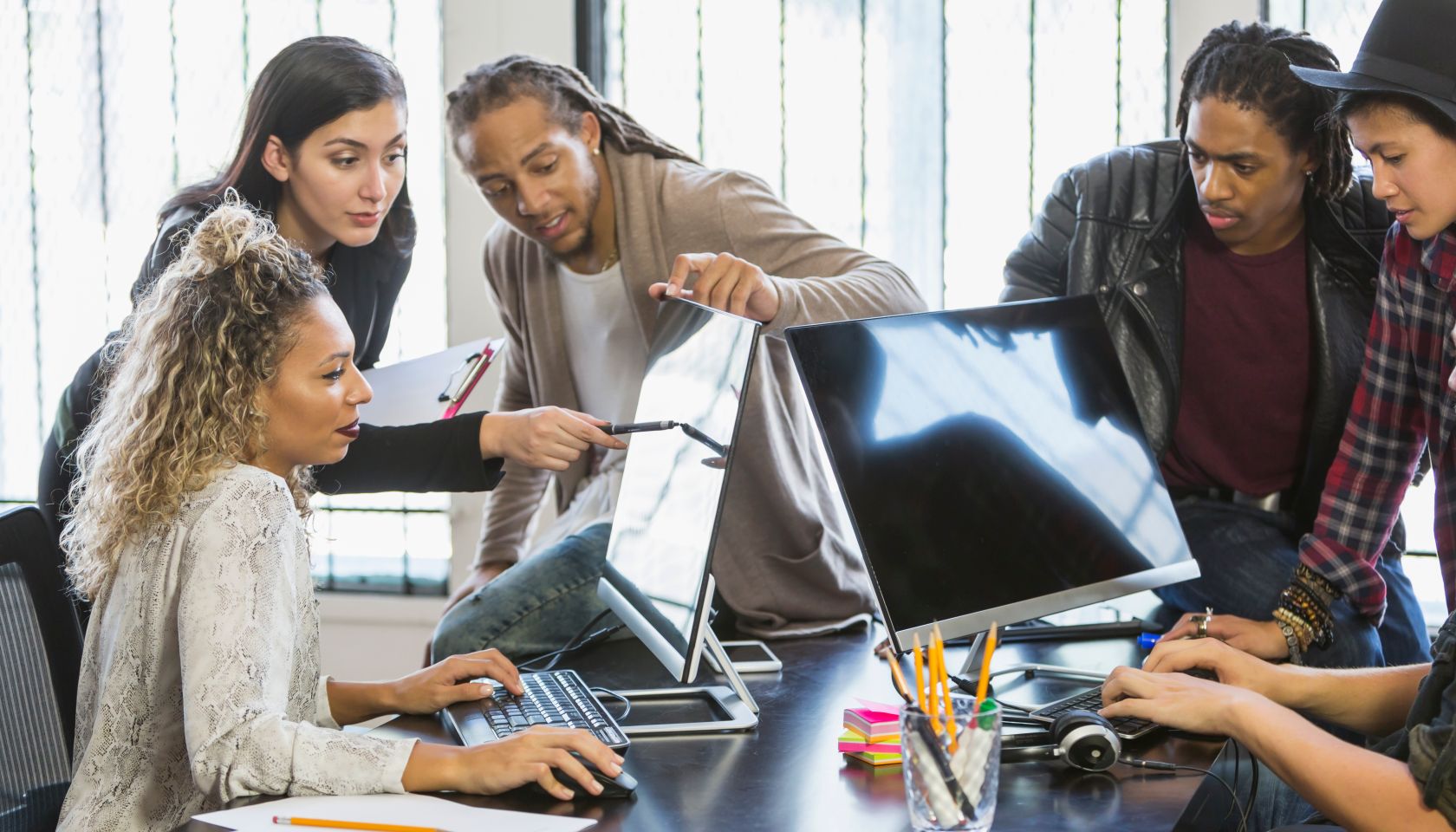Multi-ethnic young creatives in a business meeting