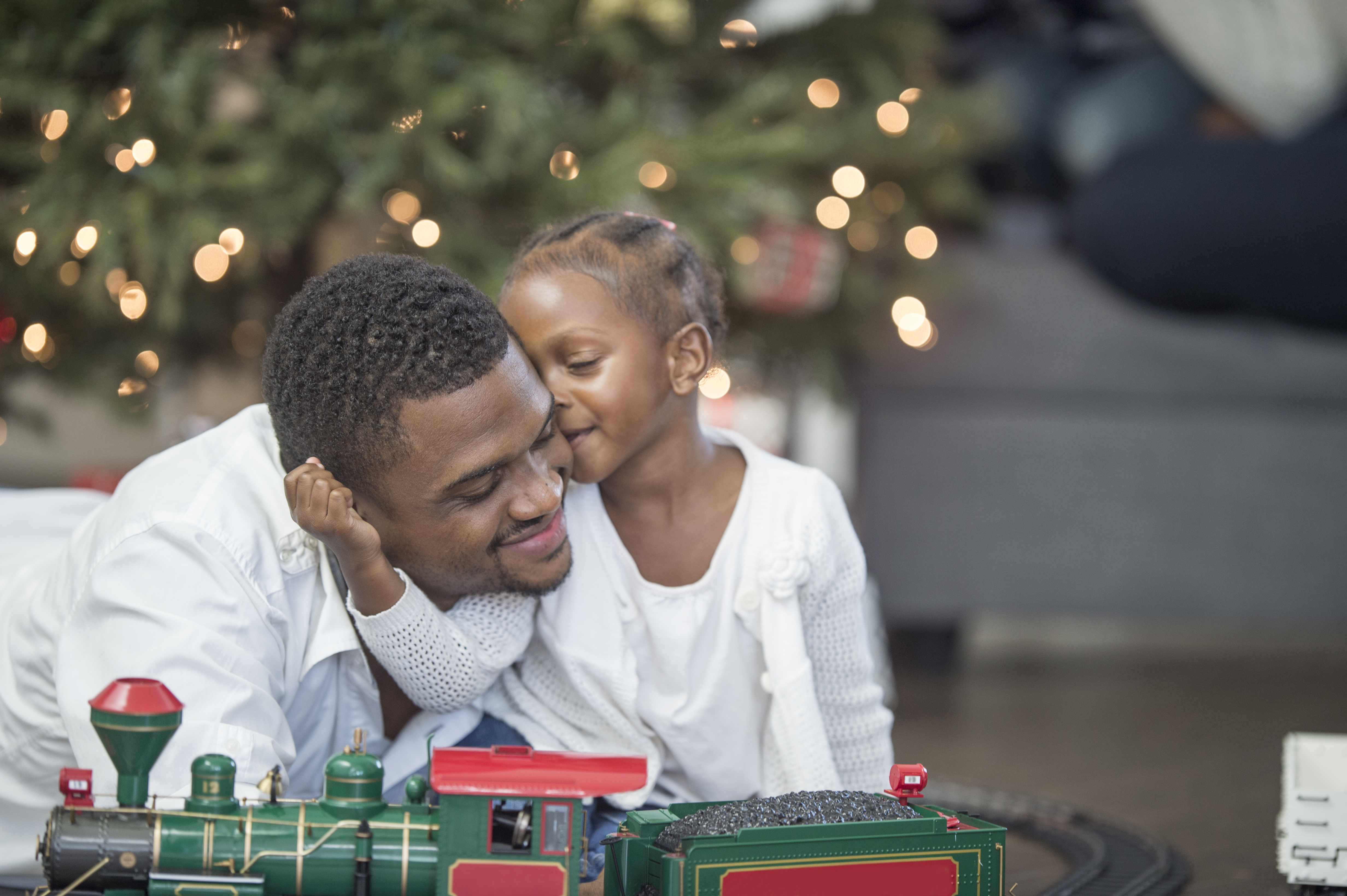 Little Girl Giving Her Father a Kiss