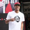 Chicago Bulls player Derrick Rose attends an in-store Adidas promotional event near Champs Elysees