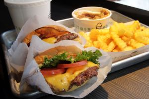 ( Boston, MA 030215) Shack Burger, front left, , Smoke Shack, back left, Fries, front right, and Newbury, back right, are seen in the Shake Shack new shop on Newbury Street in Boston, Monday, March 2, 2015. Staff Photo by Chitose Suzuki