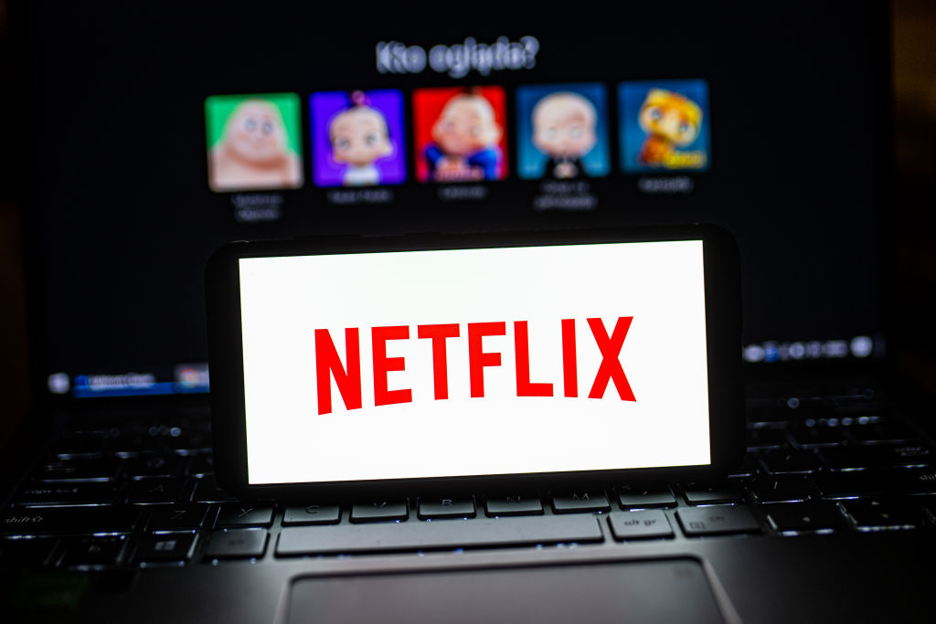 In this photo illustration a Netflix logo seen displayed on...
