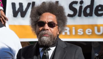 Dr. Cornel West speaks to the press at the City Hall press...