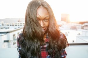 Portrait of Black woman on rooftop