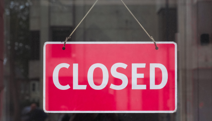 Closed sign hanging in a window